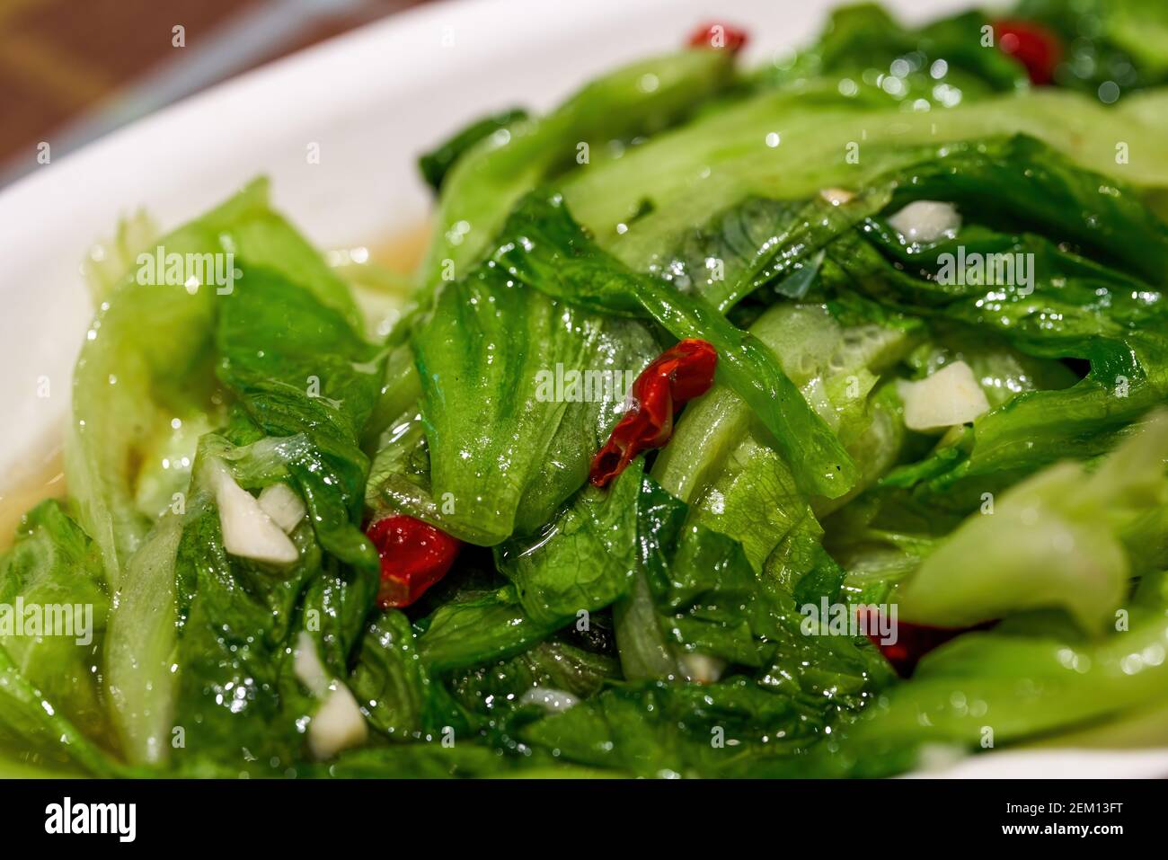 A dish of Chinese national dish, stirfried lettuce with garlic and