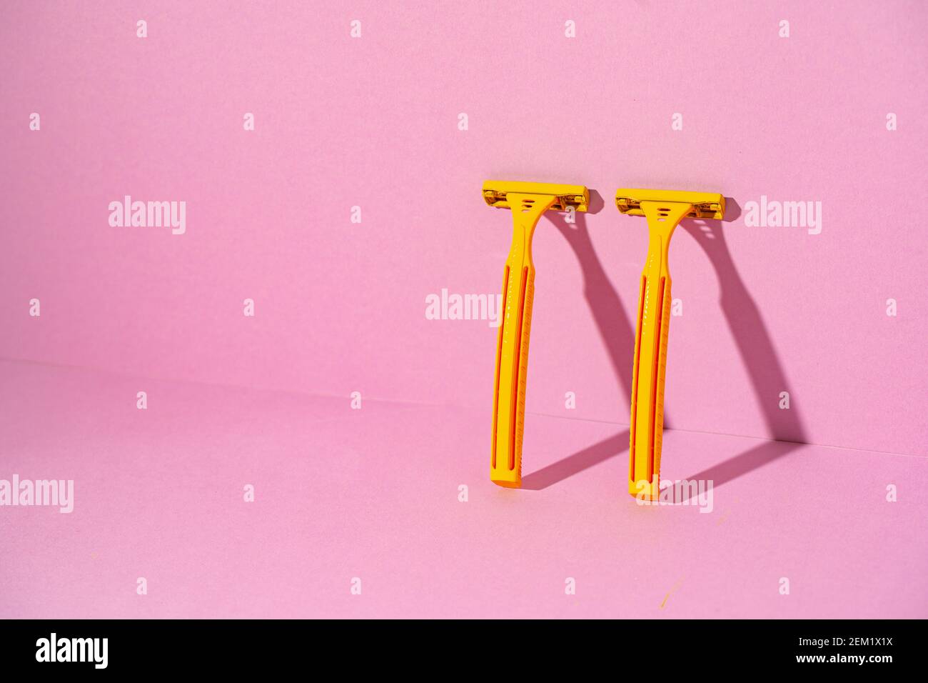 Yellow disposable razors on pink background, studio shot Stock Photo ...