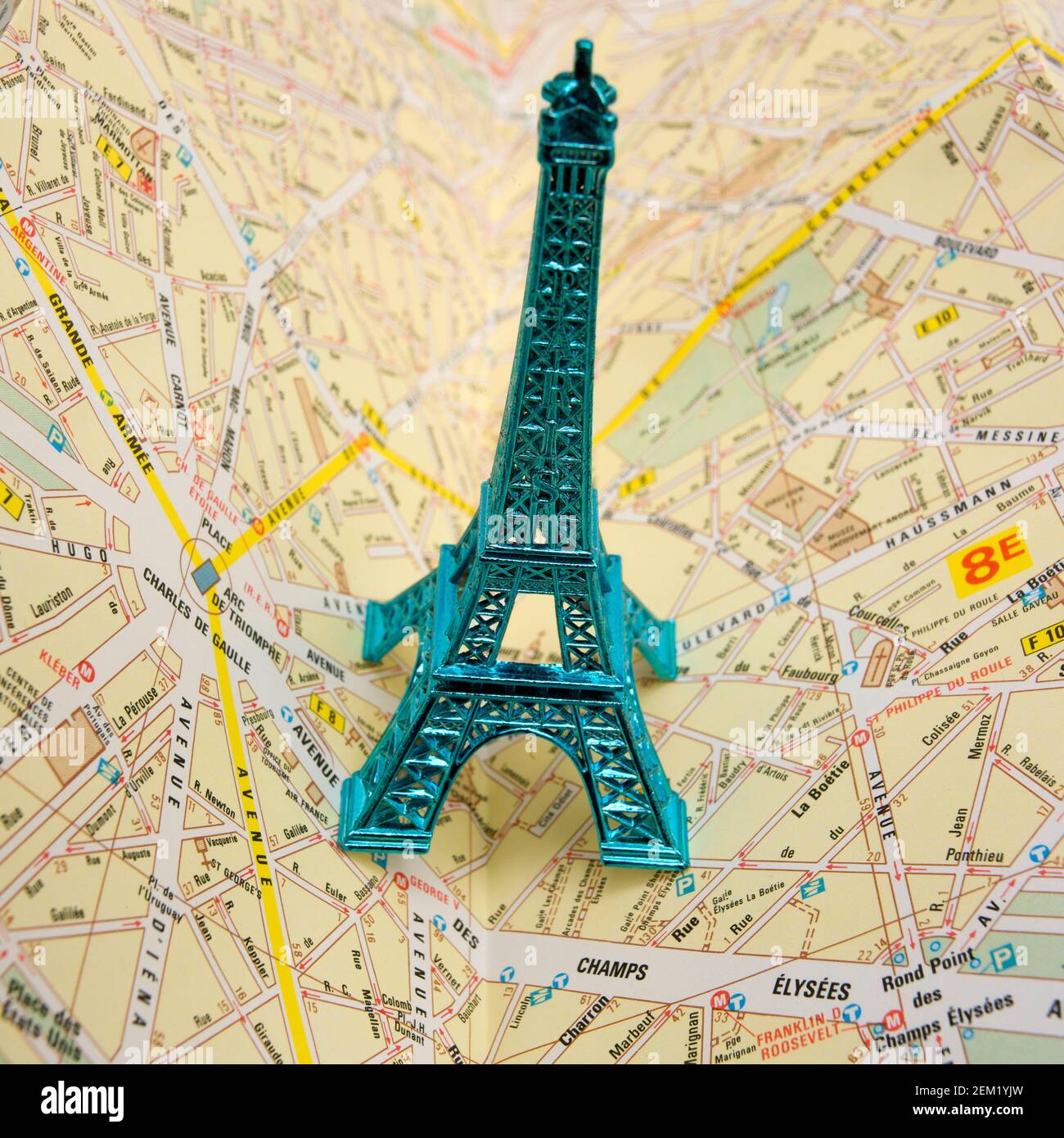 Miliature Eiffel Tower on Paris city map Stock Photo
