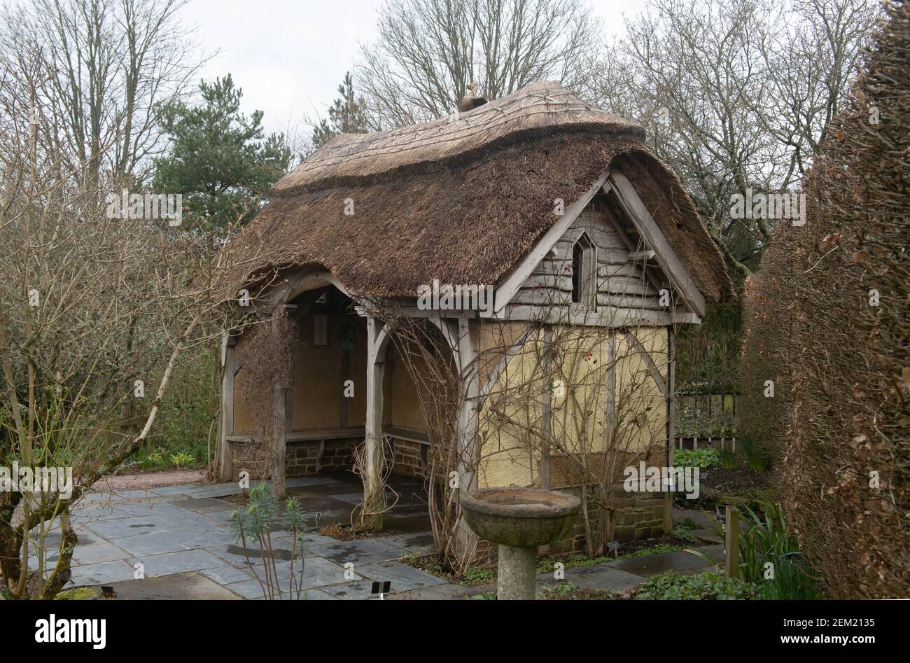 Traditional Thatched Roof Summerhouse on a Winter's Day in a Garden at Rosemoor in Rural Devon, England, UK Stock Photo