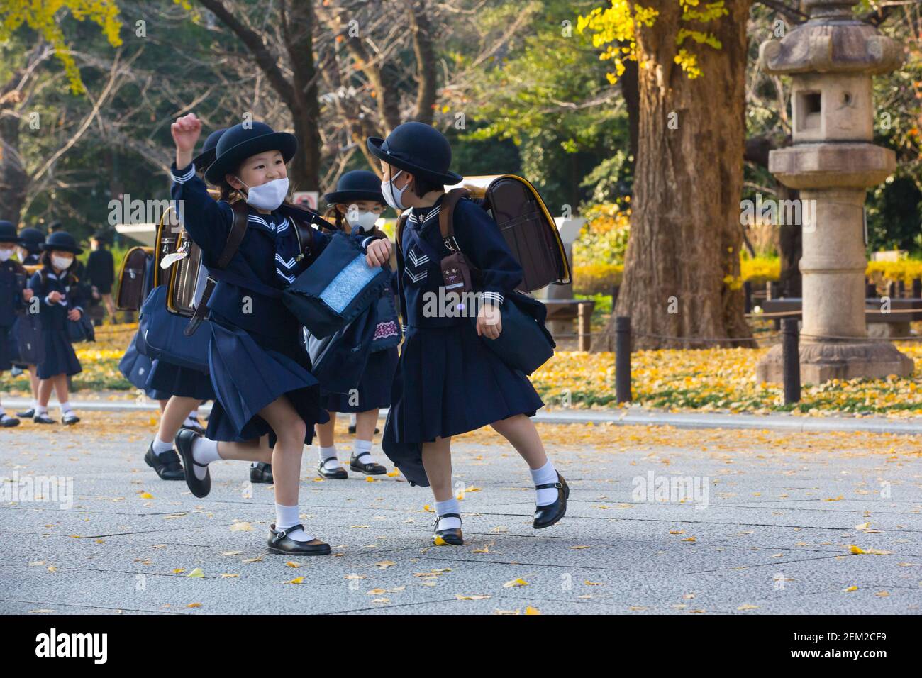Japanese elementary school students dressed in traditional uniforms while  wearing face masks walk back home after their lessons. (Photo by Stanislav  Kogiku / SOPA Images/Sipa USA Stock Photo - Alamy