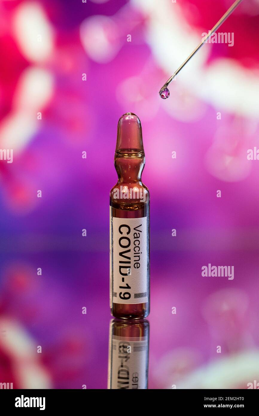 In this photo illustration, a syringe needle and ampules with fake ...