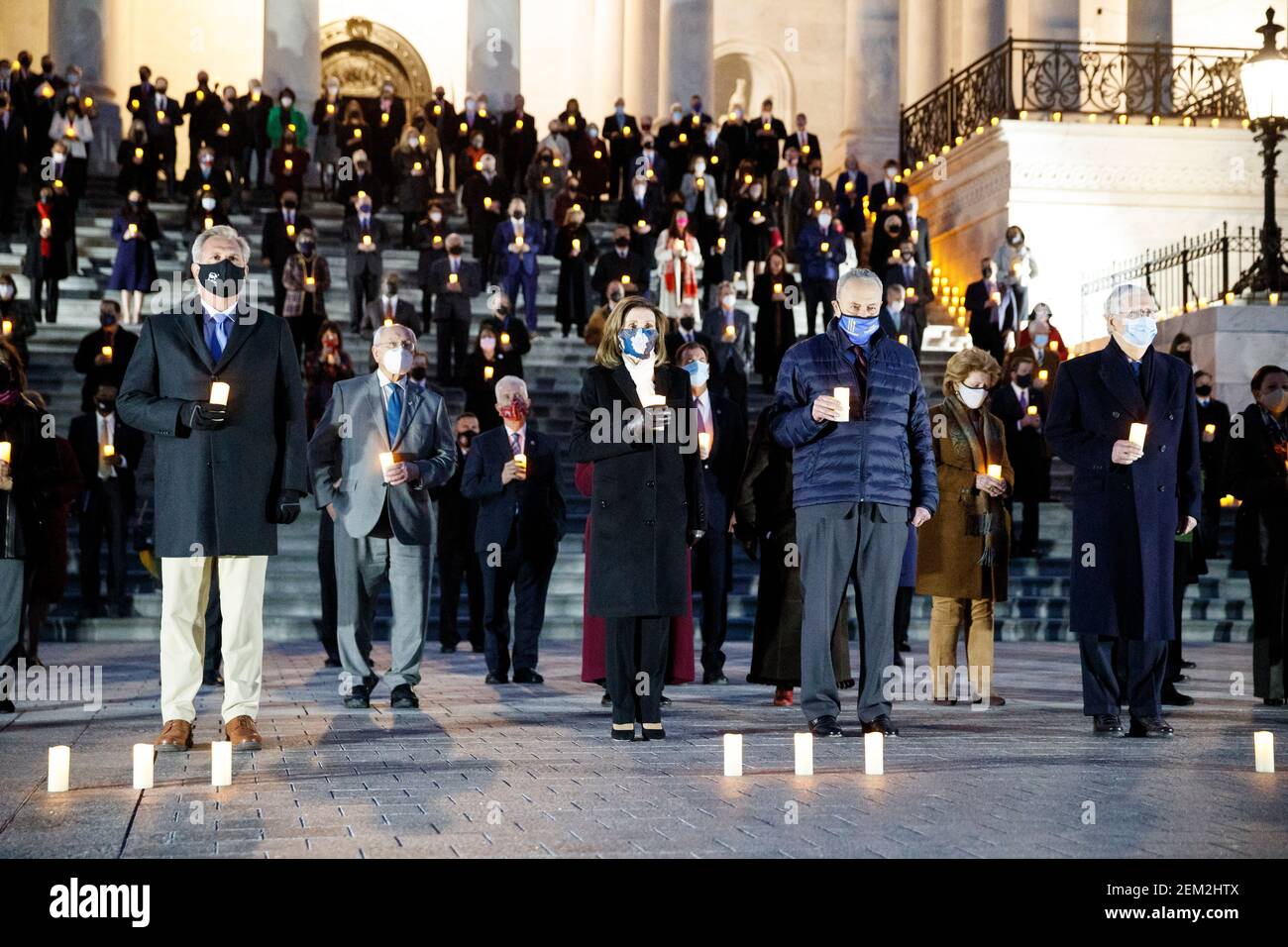 Washington, DC, USA. 23rd Feb, 2021. A bipartisan group of members of U.S. Congress participate in a moment of silence for the 500,000 American lives lost to COVID-19 on the steps of the Capitol in Washington, DC, the United States on Feb. 23, 2021. Credit: Ting Shen/Xinhua/Alamy Live News Stock Photo