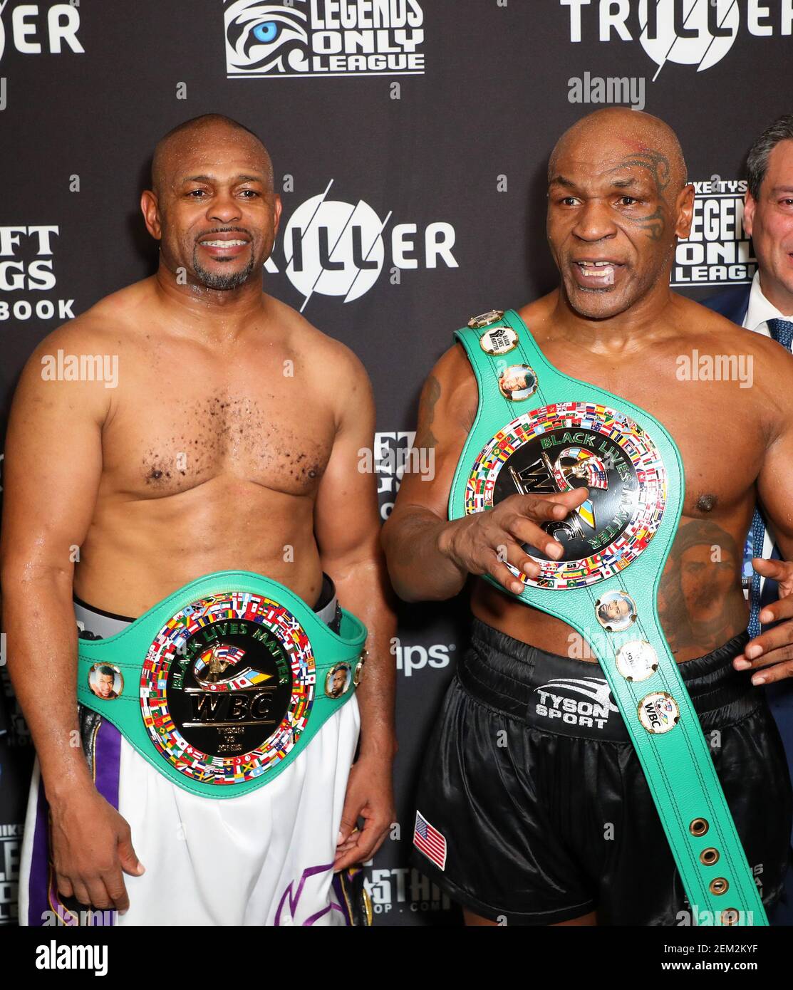 Nov 28, 2020; Los Angeles, CA, USA; Mike Tyson and Roy Jones, Jr. pose with  their belts after a split draw during a heavyweight exhibition boxing bout  for the WBC Frontline Belt