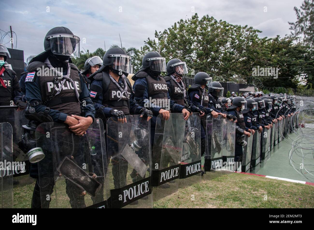 Riot policemen stand on guard in front of the 11th Infantry Regiment ...