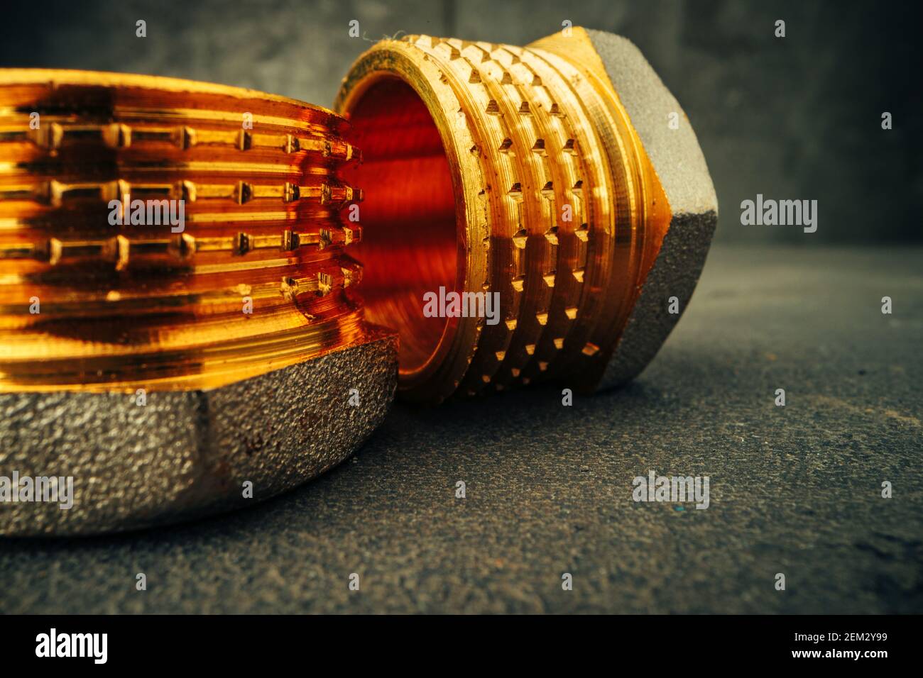 Metal golden water pipe fitting piece macro Stock Photo - Alamy