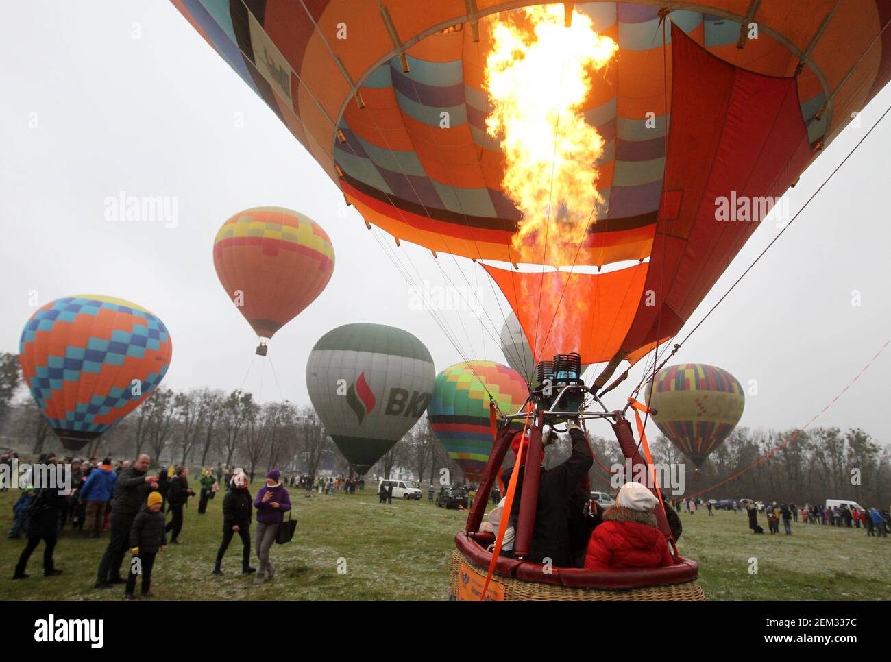 Hot air balloon with visitors ascending in the sky during the festival. The Hot  Air Balloon Festival is organized by the Hot Air Balloon Society and the  Ukrainian Aeronautical Society, a visitor