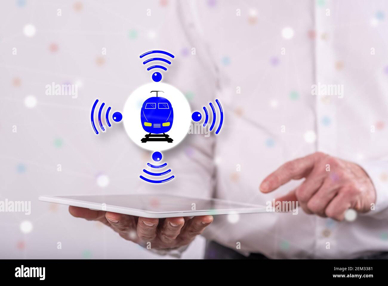 Smart train concept above a tablet held by a man in background Stock Photo
