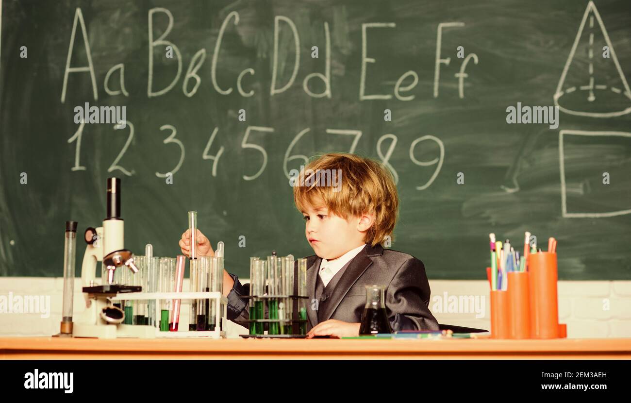 Little boy is making science experiments. little boy at lesson. Back to ...