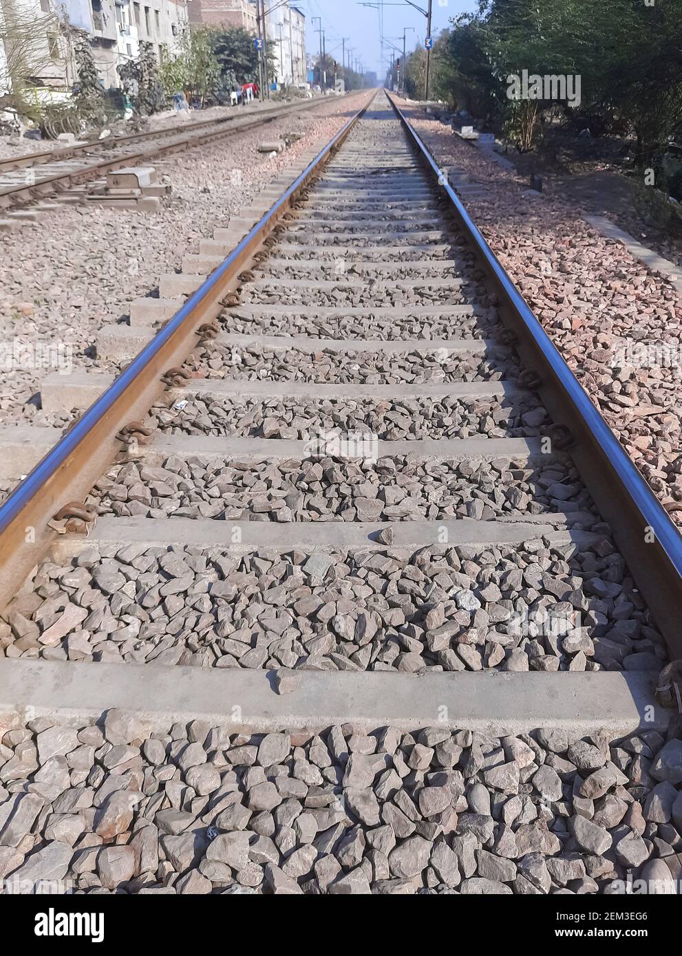 View of Railway Tracks from the middle during day time in Delhi India