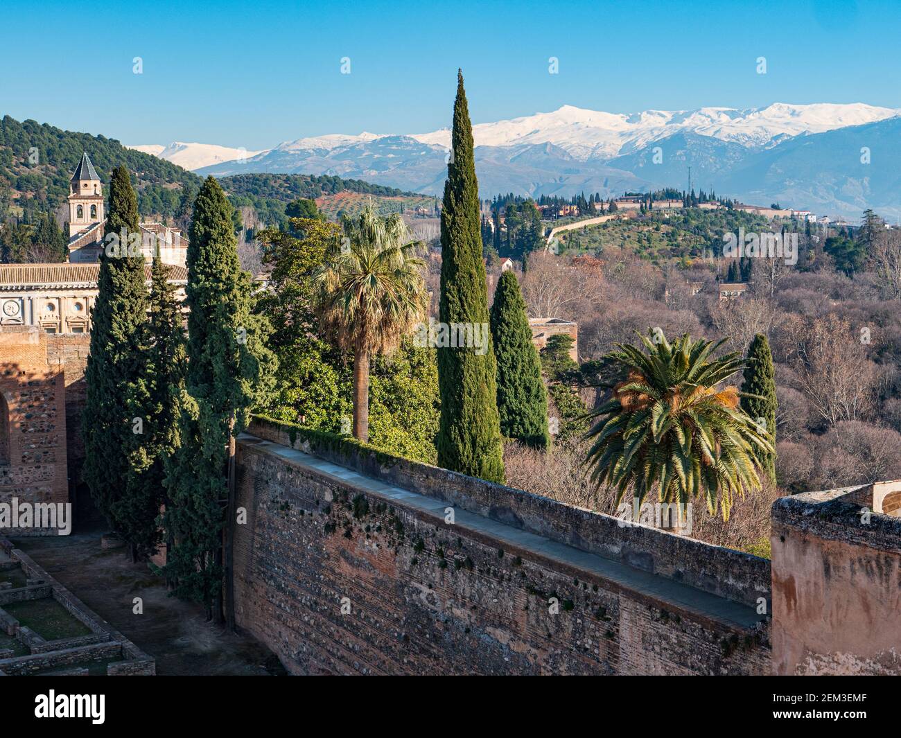 A view towards the snowcapped Sierra Nevada Mountains from The Alhambra, Granada, Spain. Stock Photo