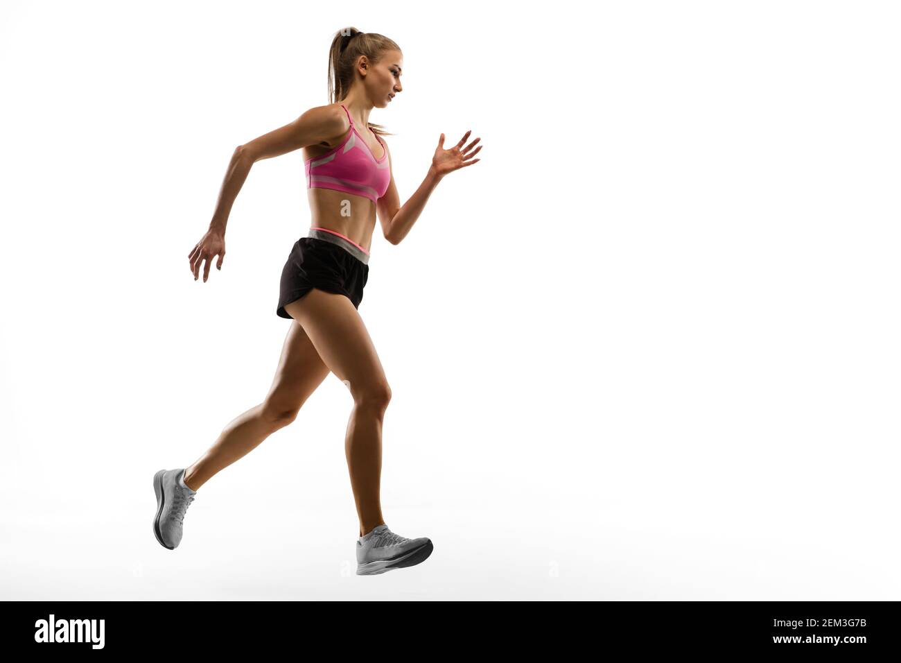 Buff Female Runner Strong. Caucasian professional female athlete, runner training isolated ...