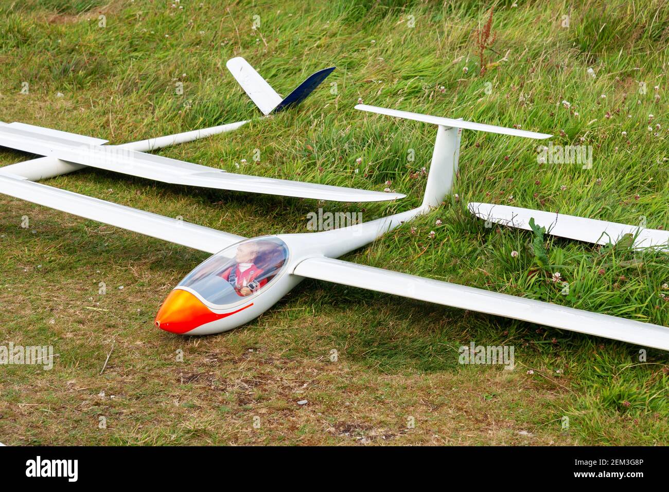 Flying model plane with dummy pilot used for aeromodelling Stock Photo
