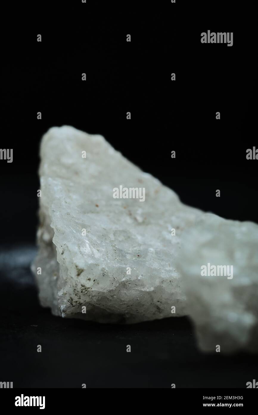 Crystalized salt rocks on dark background. Close up Stock Photo