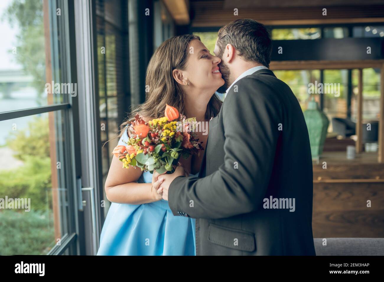 Man hugs woman bouquet hi-res stock photography and images - Alamy