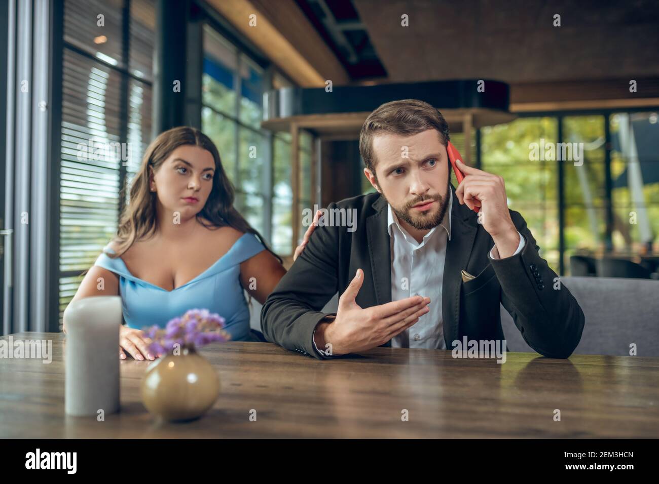 Woman talking inattentive man hi-res stock photography and images - Alamy