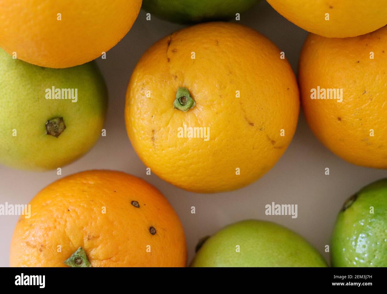 Beautiful lemons and oranges arranged on a table. A fruit rich in