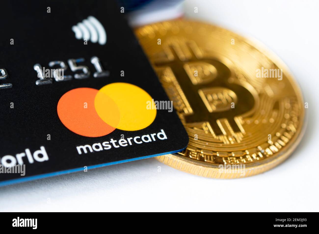 Gold Bitcoin coins with the MasterCard logo on background screen Stock  Photo - Alamy