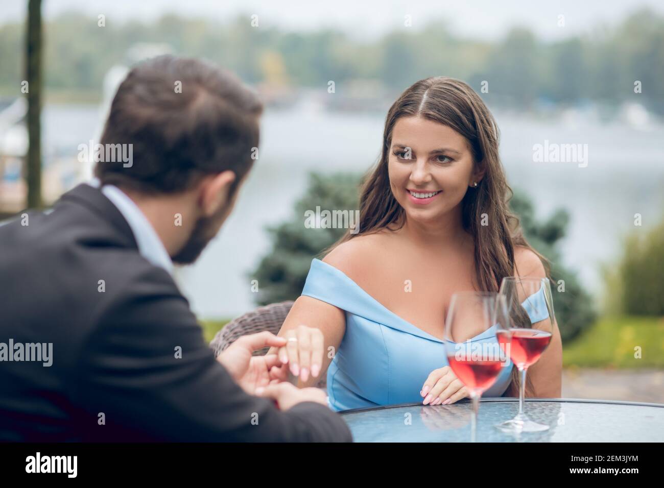 Happy pretty woman and man holding hand Stock Photo