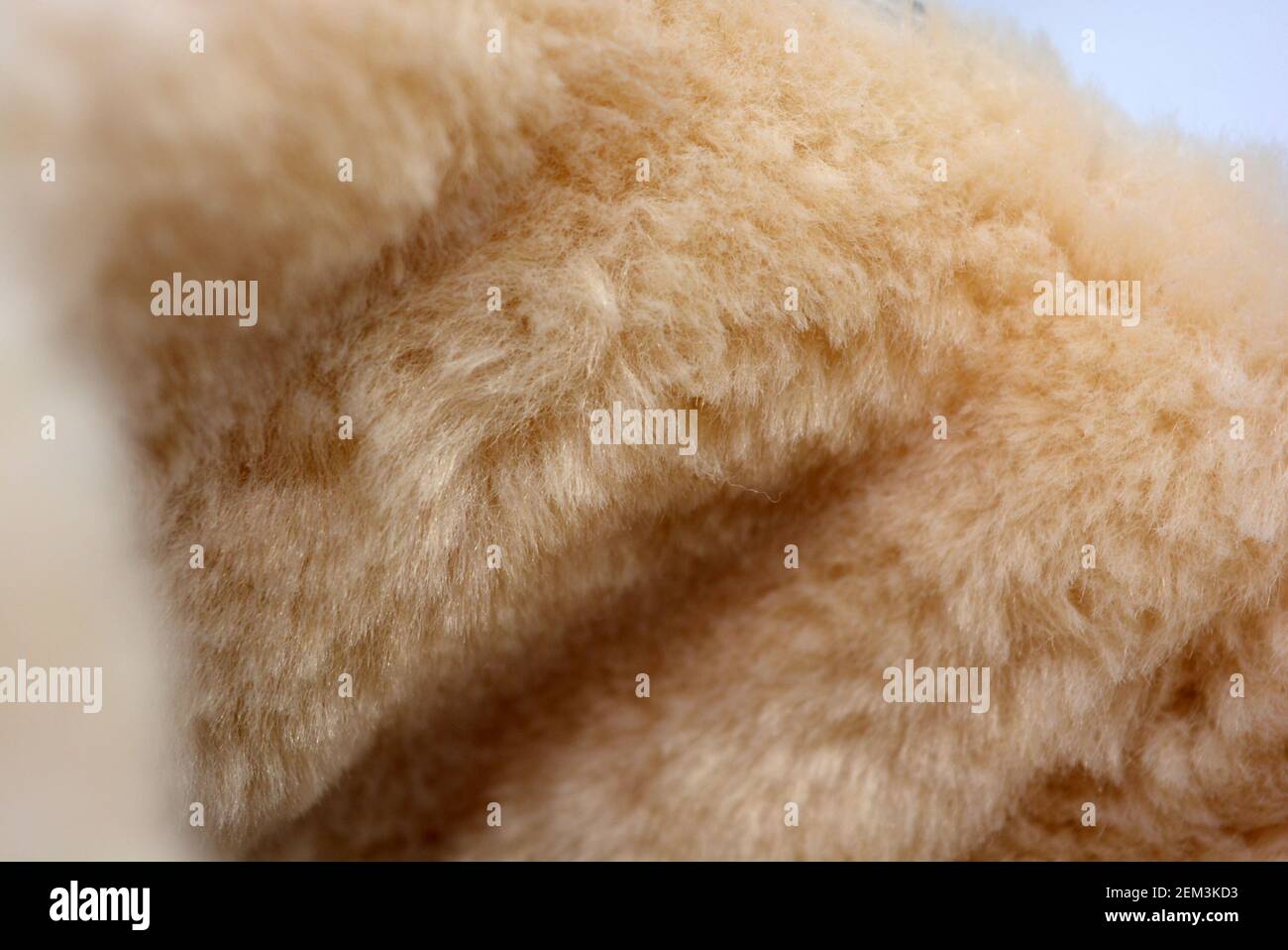 White light fur with wide fiber. Dense synthetic material. Warm