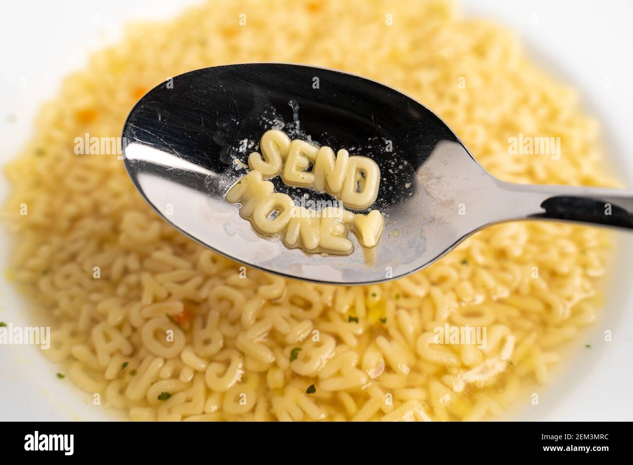 Alphabet soup letters with Send Money on the spoon, instant easy fast