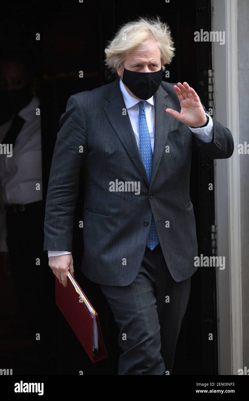 Prime Minister Boris Johnson leaves 10 Downing Street to attend Prime Minister's Questions at the Houses of Parliament, London. Picture date: Wednesday February 24, 2021. Stock Photo