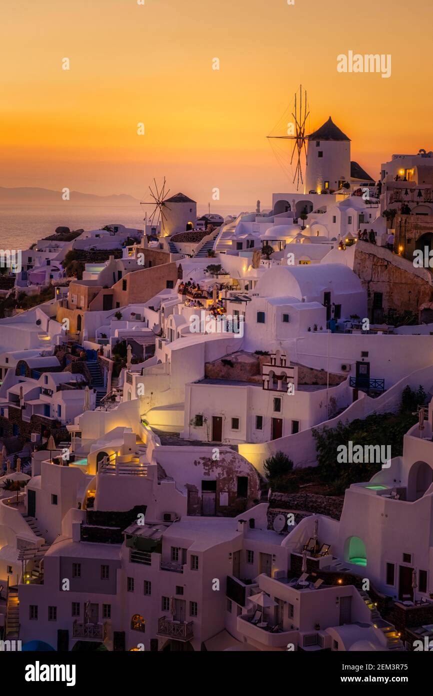 Oia Village Santorini With Blue Domes And White Washed House During oia-village-santorini-with-blue-domes-and-white-washed-house-during