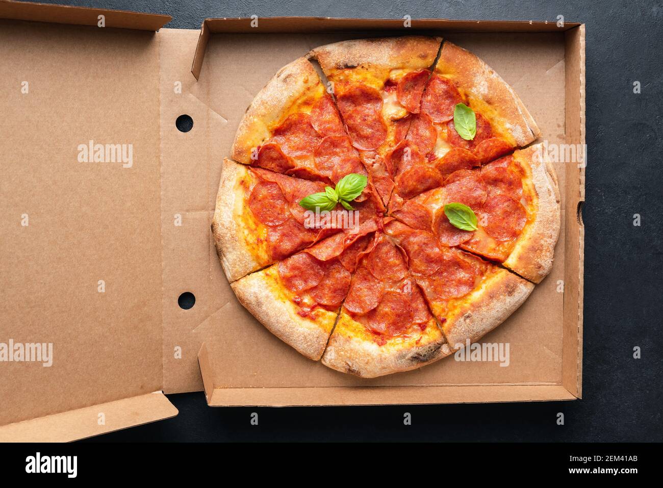 Pepperoni pizza in carton box. Pizza delivery. Top view Stock Photo