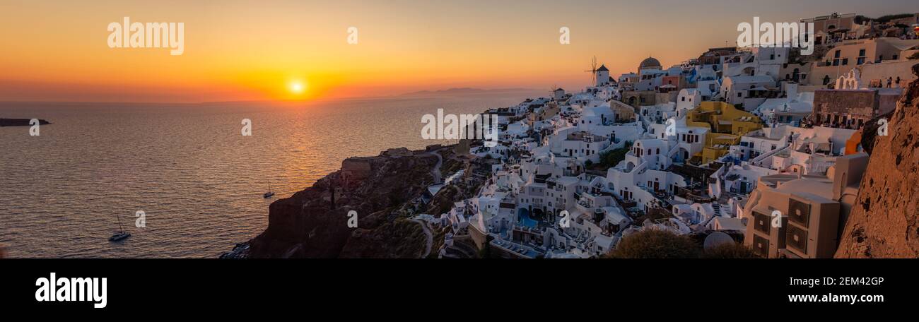 Oia village Santorini with blue domes and white washed house during sunset at the Island of Santorini Greece Europe, sunrise Santorini Stock Photo