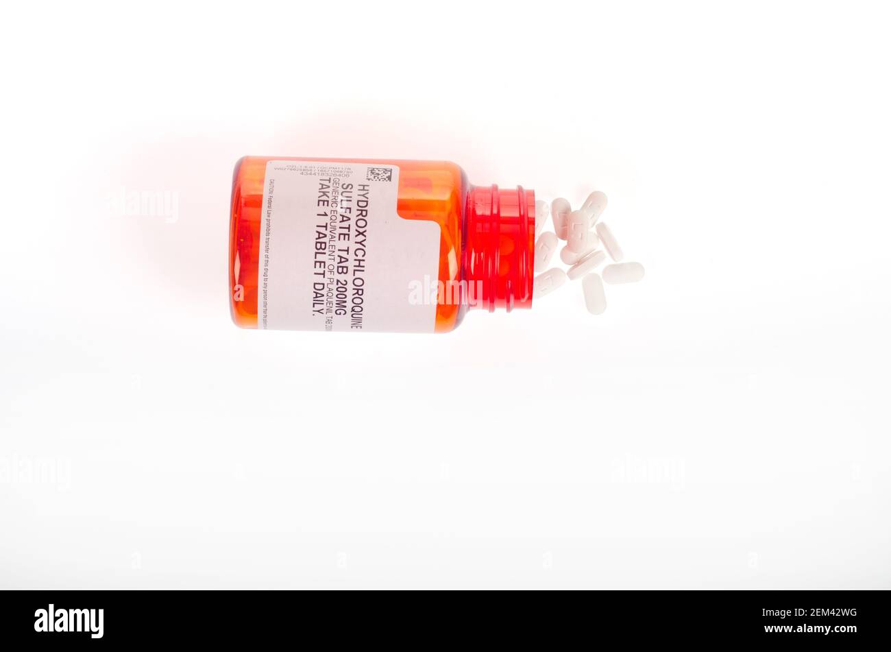 Hydroxychloroquine, common brand name Plaquenil, an immunosuppresive & anti-parasite drug prescription pill bottle open with pills showing Stock Photo