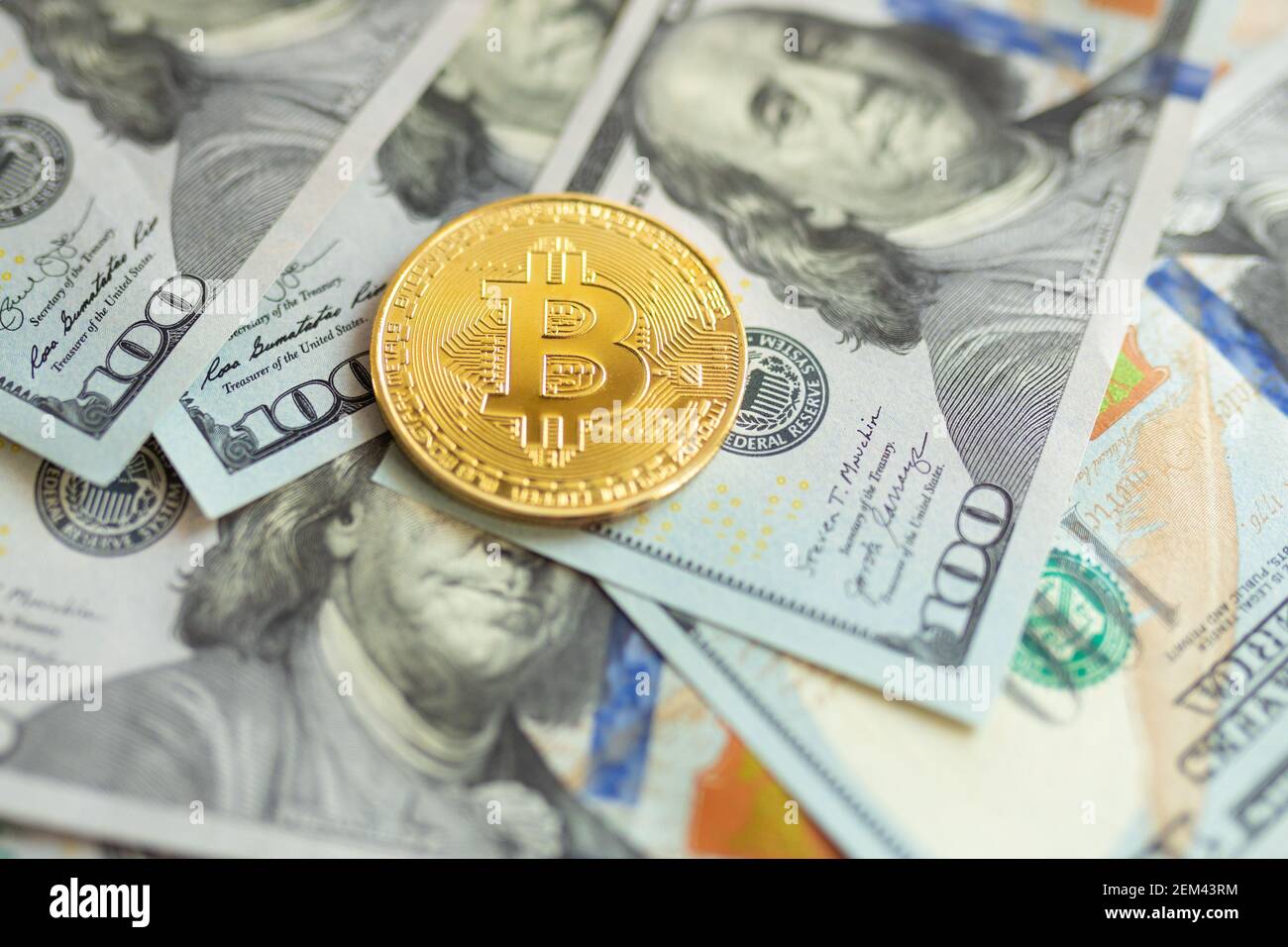 Golden and silver bitcoin on hundred dollars abstract background. Crypto-currency  Stock Photo - Alamy