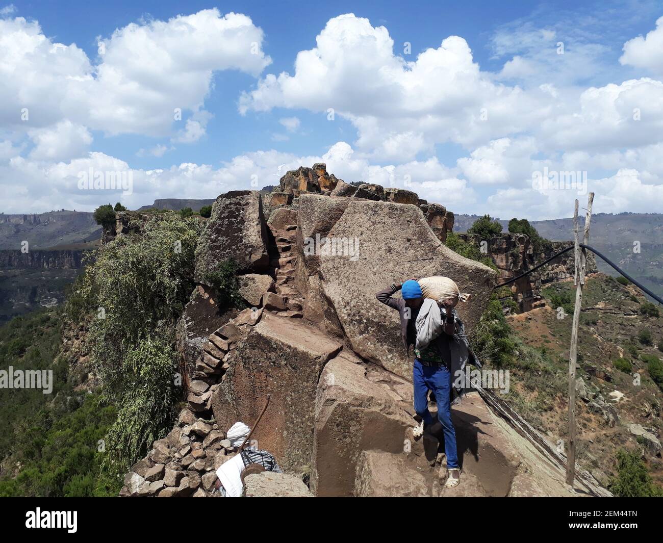 Amhara-Ethiopia - April 21-2020: Ethiopian men navigate a high mountain path in Ethiopian highlands Stock Photo