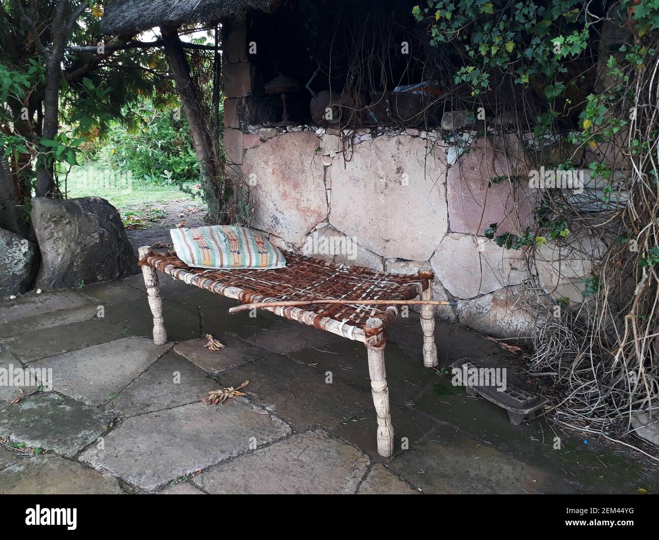 Traditional African wood frame and leather strap bench Stock Photo