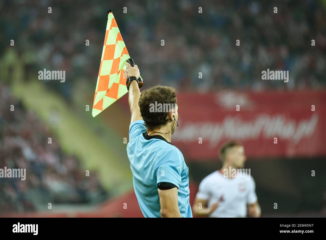 Assistant of football referee with raised flag Stock Photo Alamy