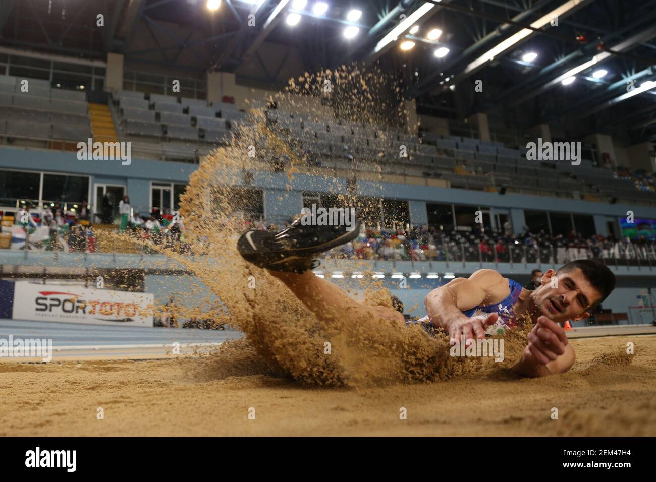ISTANBUL, TURKEY - FEBRUARY 20, 2021: Undefined athlete long jumping ...