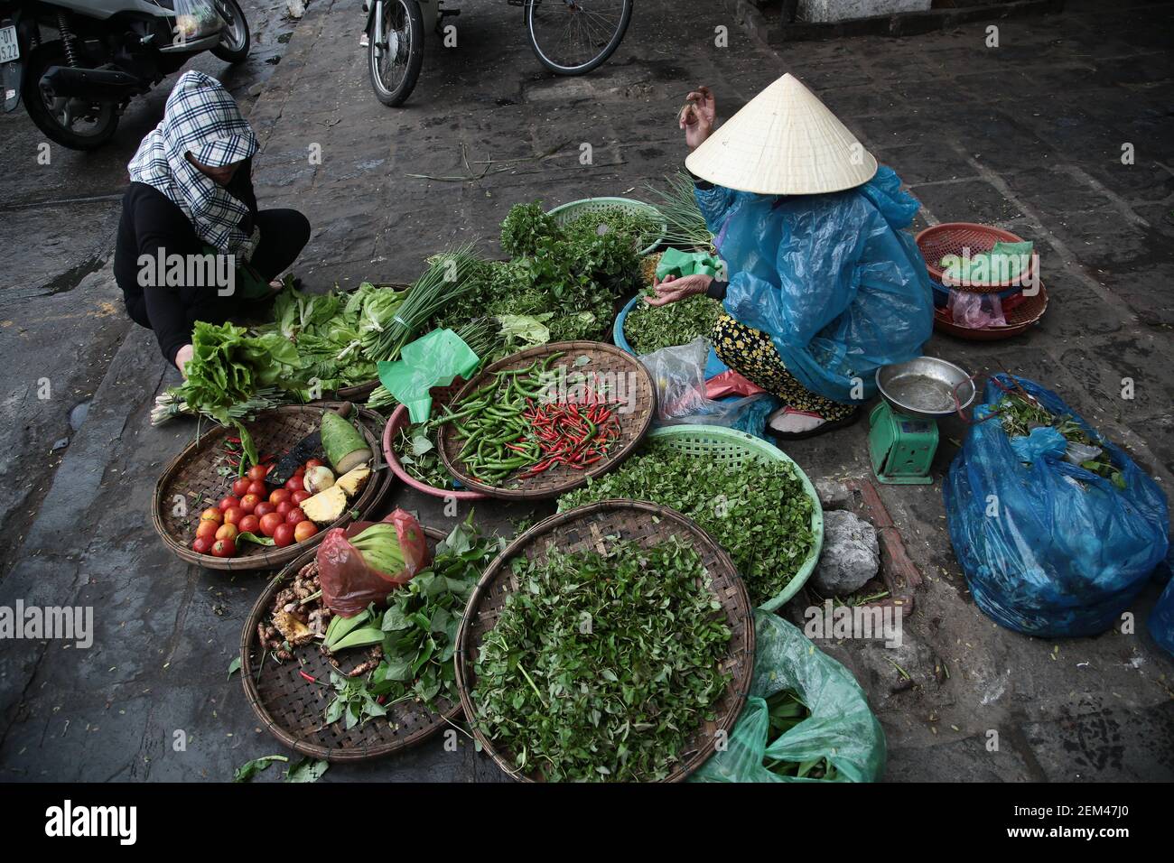 Traditional street vendors in Hoi An in Vietnam. From a series of