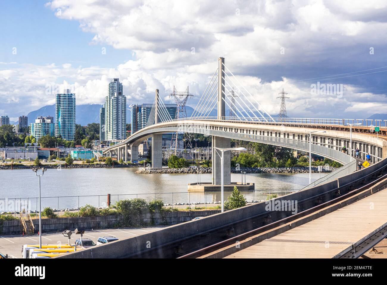 View from the TransLink SkyTrain on the Canada Line about to cross the Fraser River near Bridgeport, Vancouver, British Columbia, Canada Stock Photo