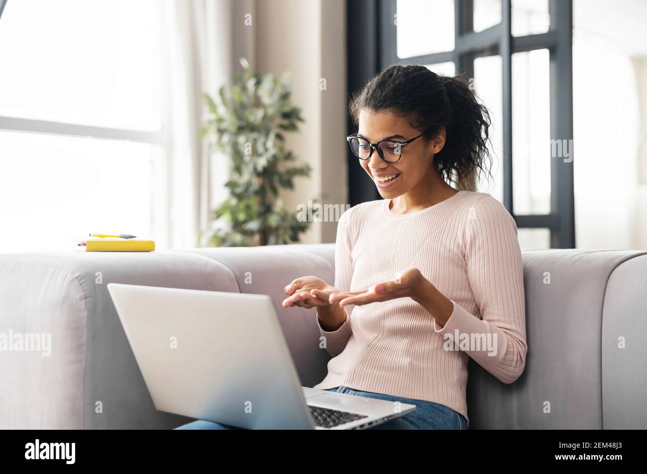 Positive smart young African American female freelancer or a student in ...