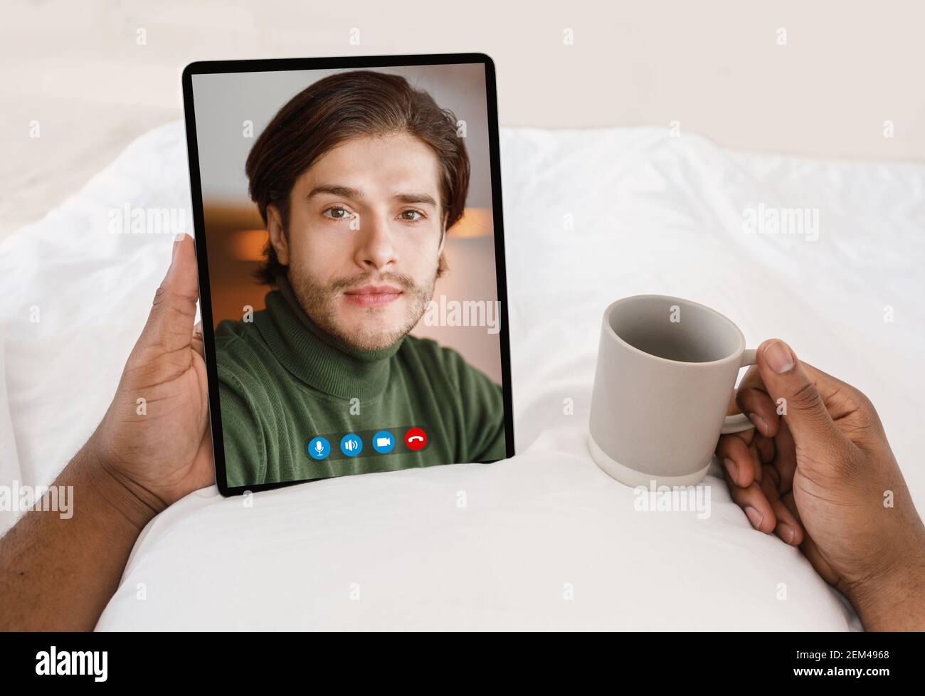 Black Man Having Video Call With Caucasian Man Stock Photo - Alamy