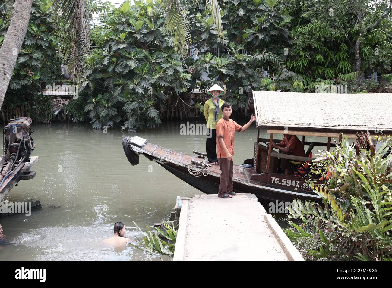A tourist boat on a river in the Mekong delta in Vietnam. From a series ...
