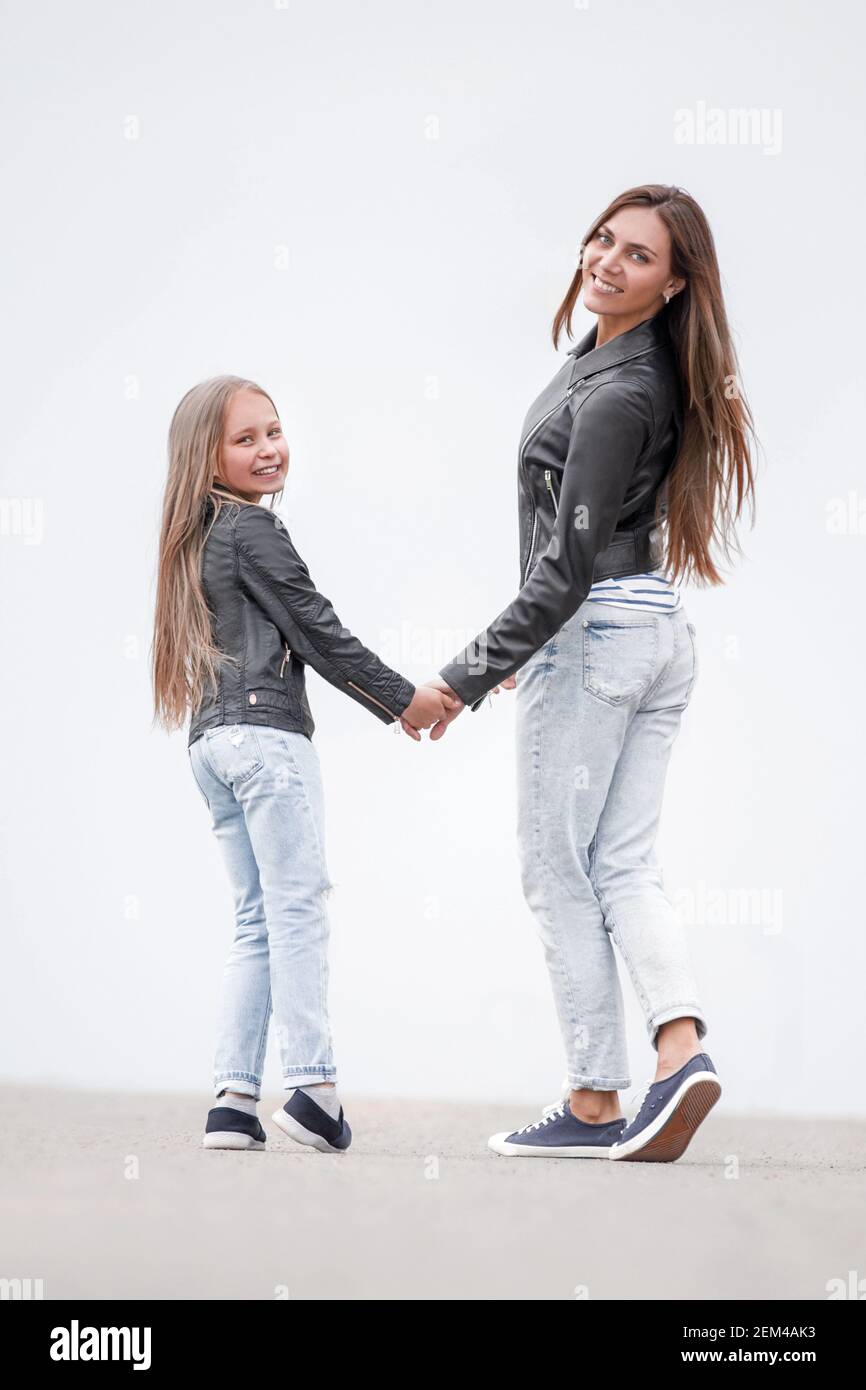 rear view. happy mother and daughter walk together Stock Photo - Alamy