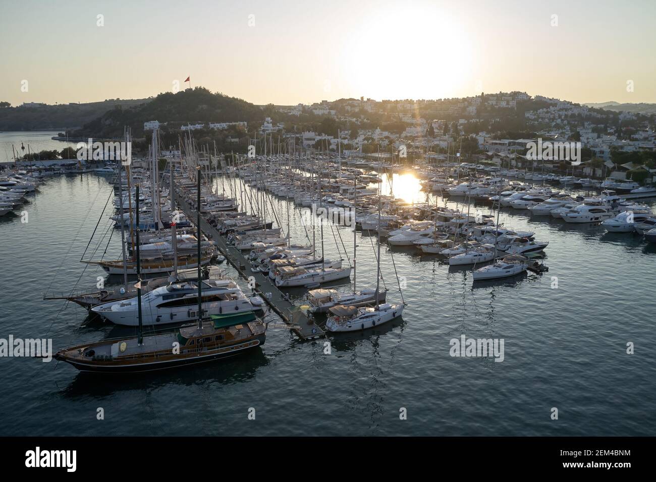 View of beautiful harbor and boats at sunset. Stock Photo