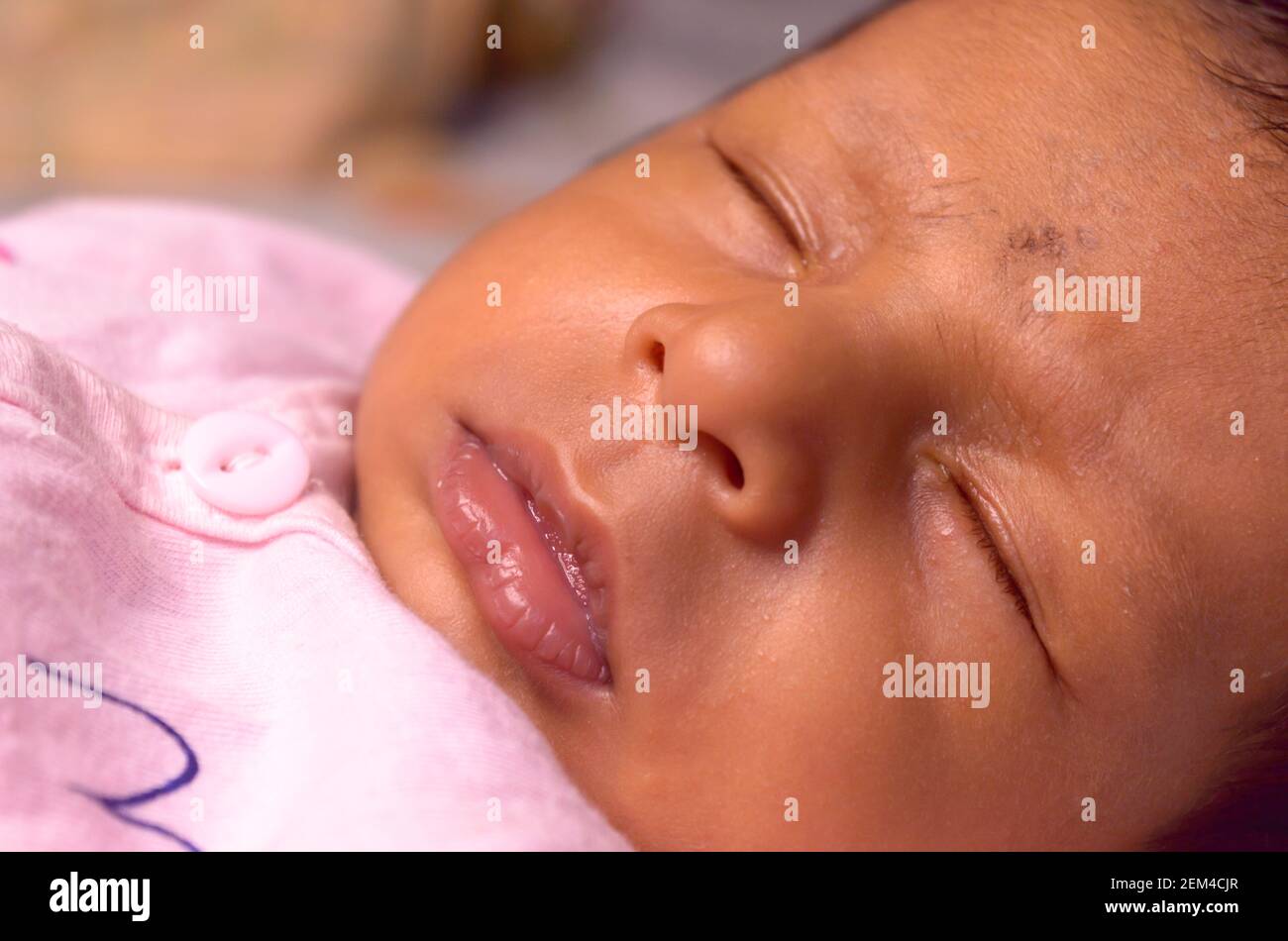 Indian baby girl resting in hi-res stock photography and images - Alamy