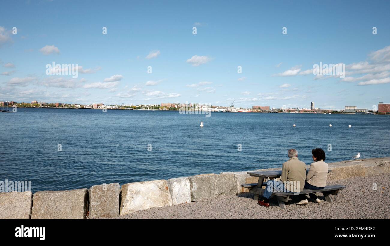 old couple watch the sea in boston Stock Photo