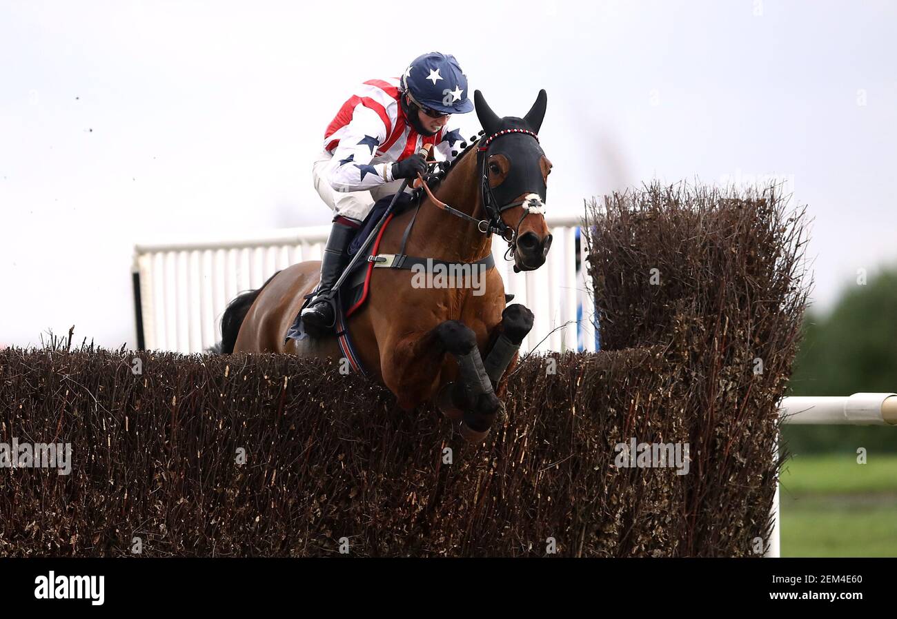Beau Bay ridden by jockey Charlie Hammond clears the last fence on the way to winning the Virgin Bet Veterans' Handicap Chase (Leg 2 Of The Veterans' Chase Series) at Doncaster Racecourse. Picture date: Wednesday February 24, 2021. Stock Photo