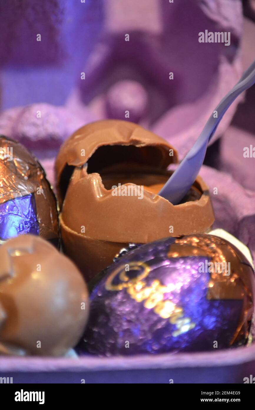 Chocolate Easter Eggs And A Purple Spoon In An Egg Box Easter