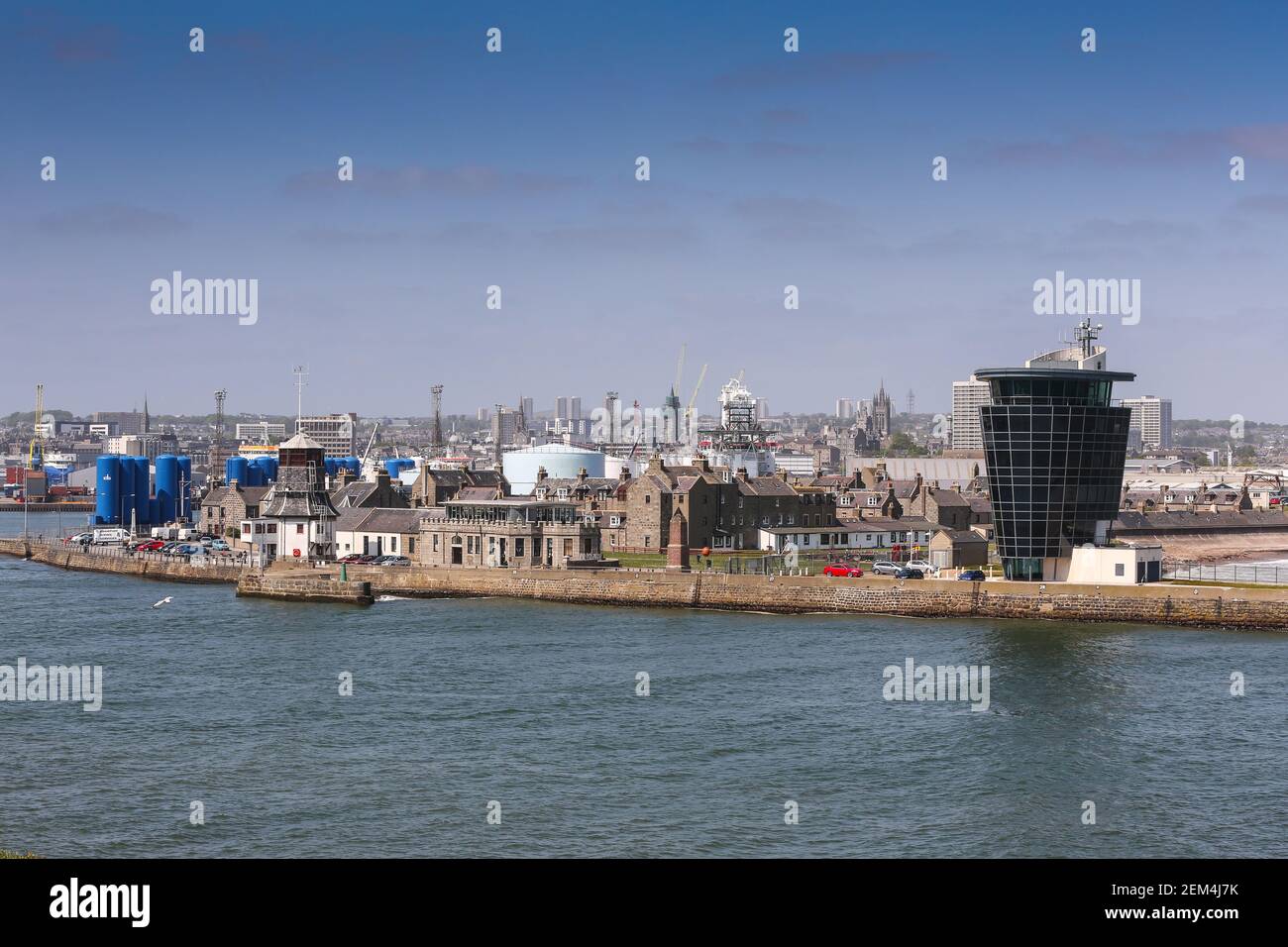 The harbour shipping control tower (right) with the old Roundhouse visible on the left, in Aberdeen, Scotland Stock Photo