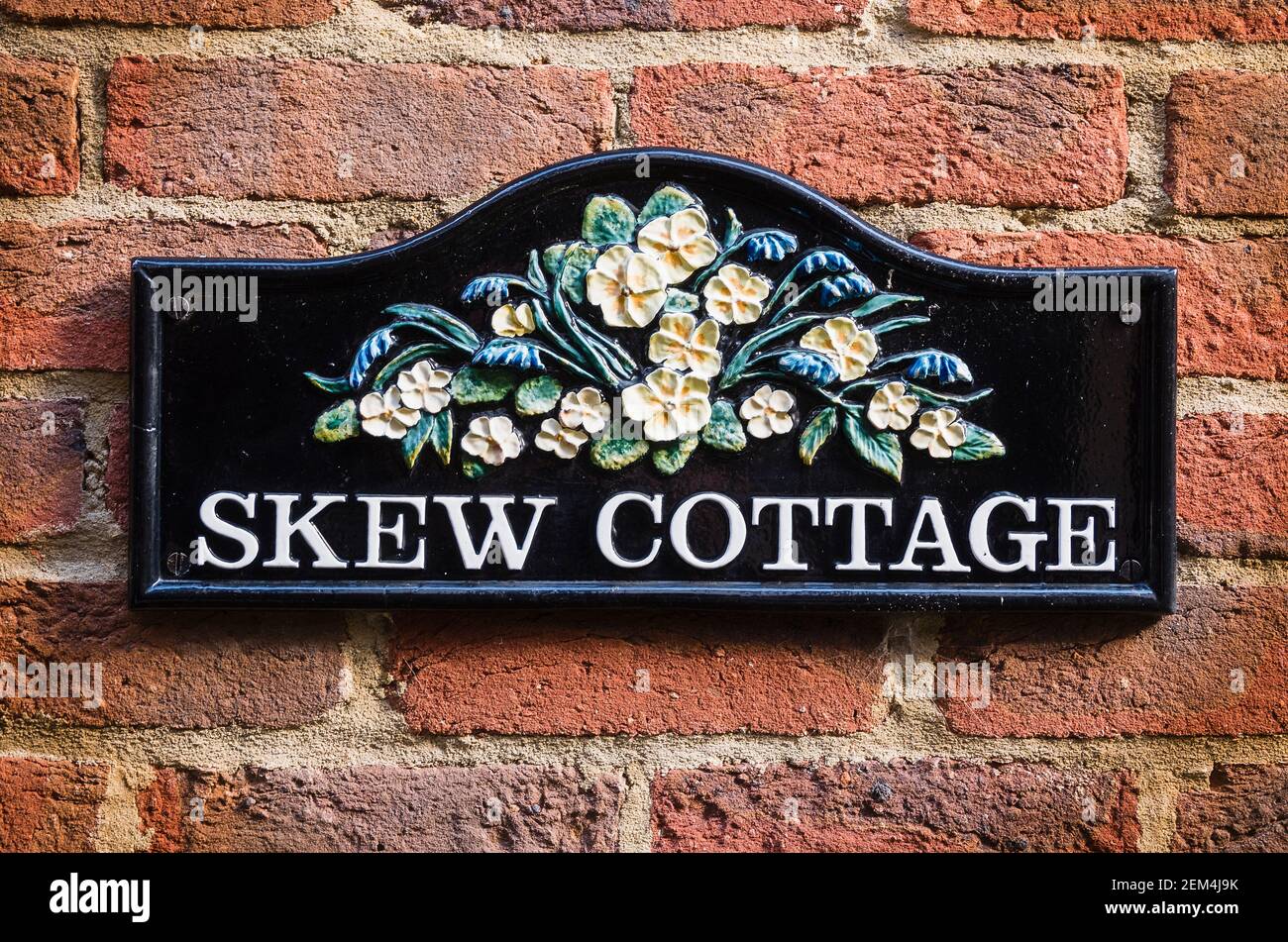 An unusual name for a town cottage with front walls sliightly skewed to fit in with the course of an ancient Alley in the centre of Devizes Wiltshire Stock Photo