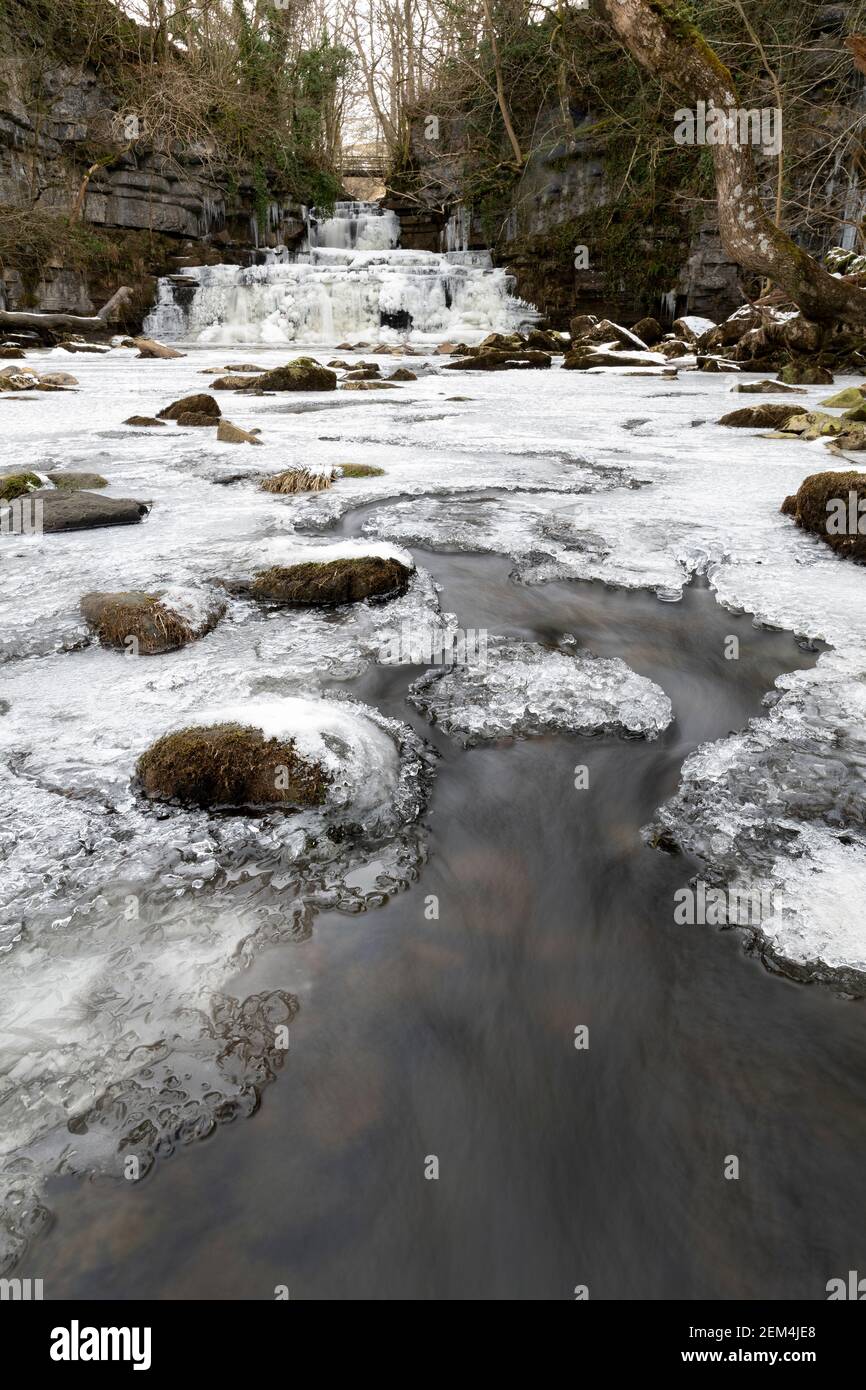 Cotter Force in the Yorkshire Dales National Park covered in ice during a cold spell. North Yorkshire, UK. Stock Photo