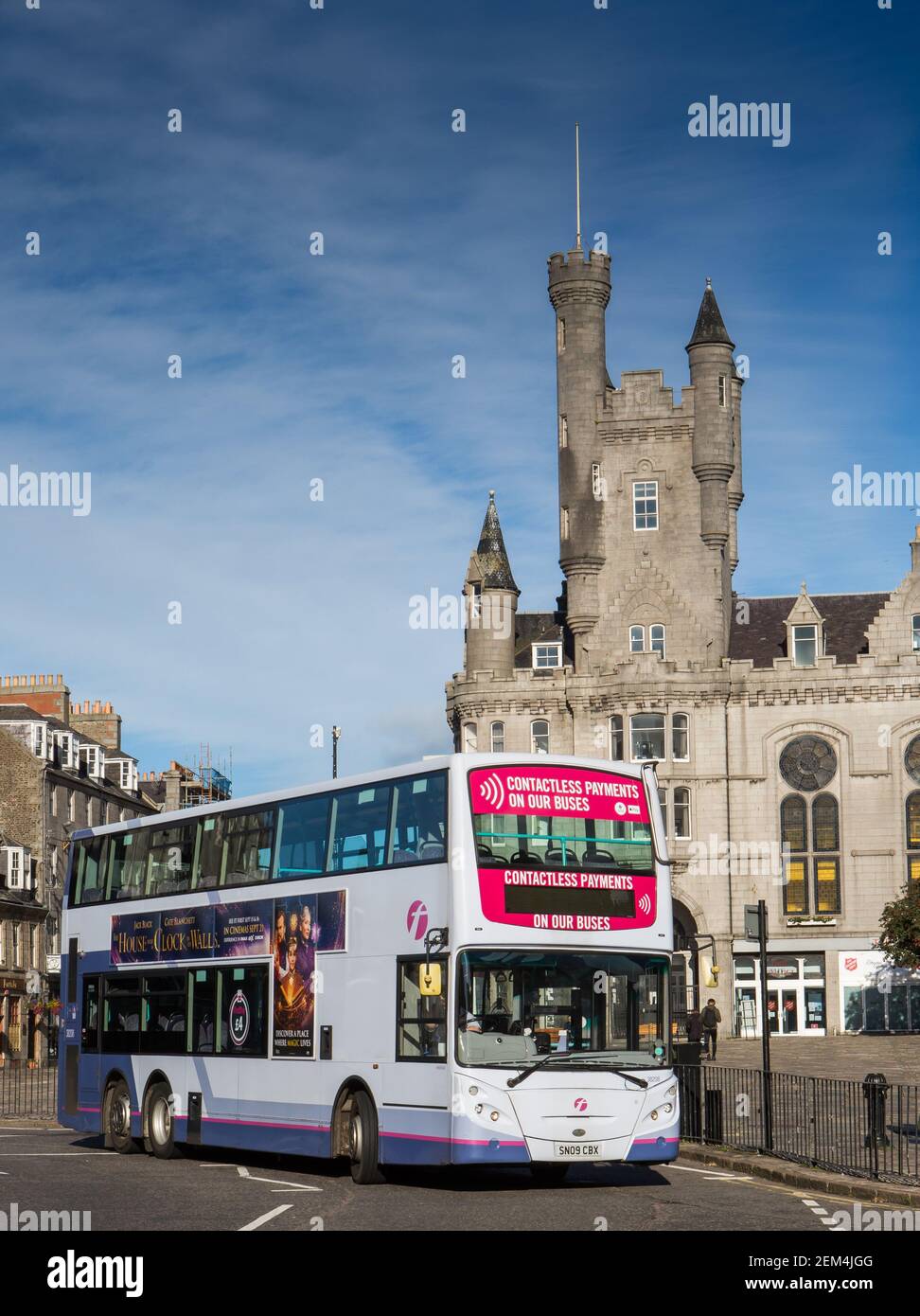 Double decker First bus passes the Citadel in Union Street in the city centre of Aberdeen, Scotland Stock Photo